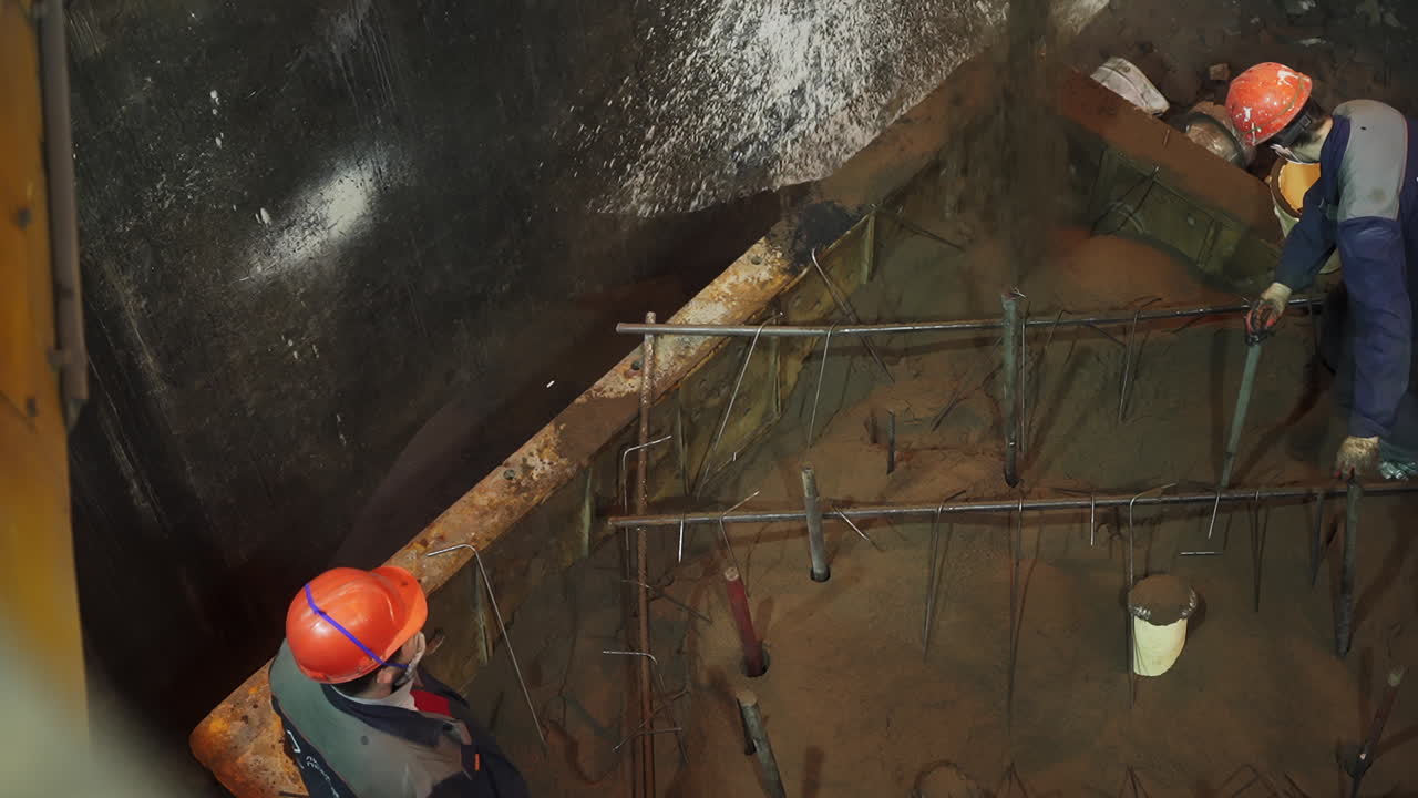 Construction Workers Pouring Concrete Foundation
