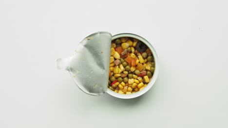 open tin of mixed vegetables and tuna