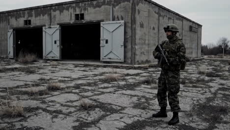 military personnel guarding an abandoned warehouse