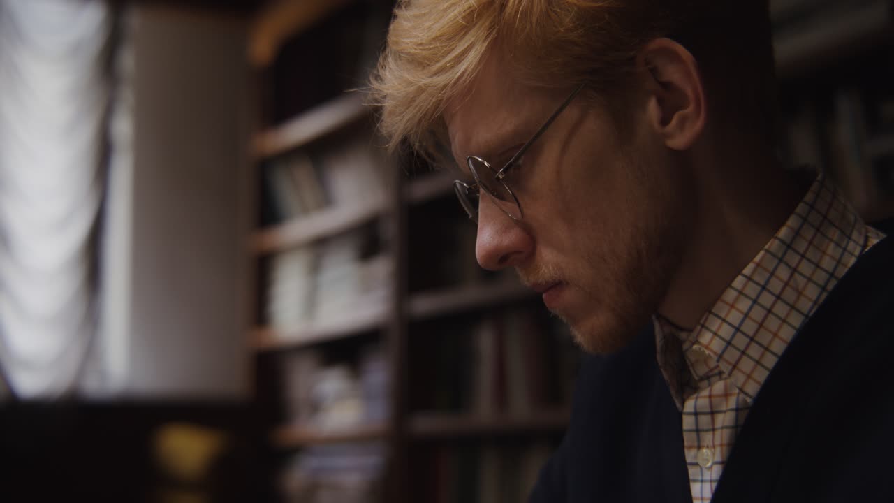 Man Reading in a Library