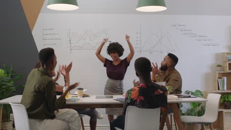 happy business people celebrating success enjoying corporate victory team leader woman excited colleague using smartphone taking video of presentation sharing on social media