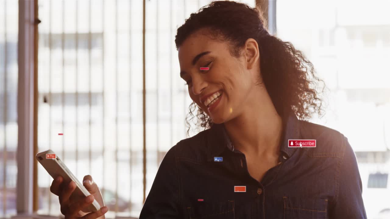 Woman sitting at cafe looking at phone, browsing social media, Subscribe Play icons appearing