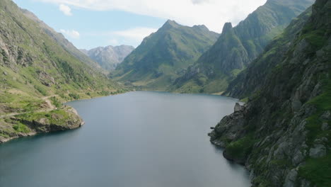 passing over the dam of the artificial lake in soulcemin the french pyrenees mountains