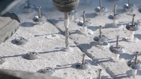 drilling anchors into concrete