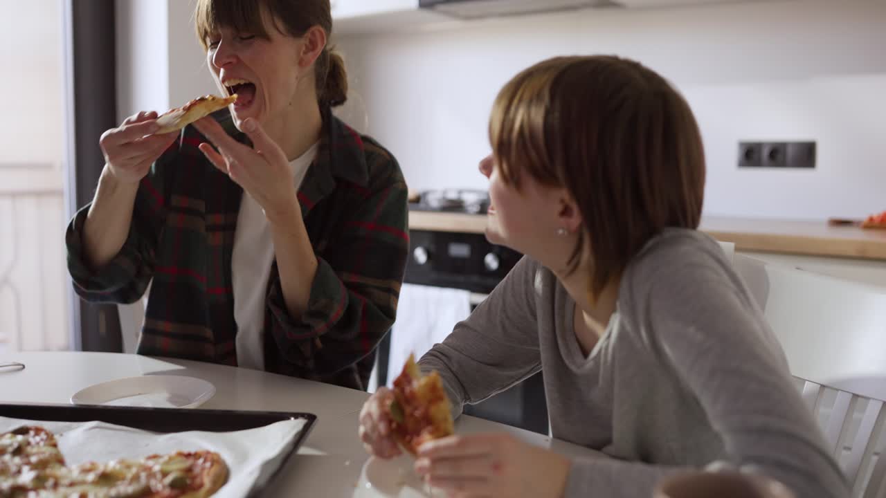 Family eating pizza together