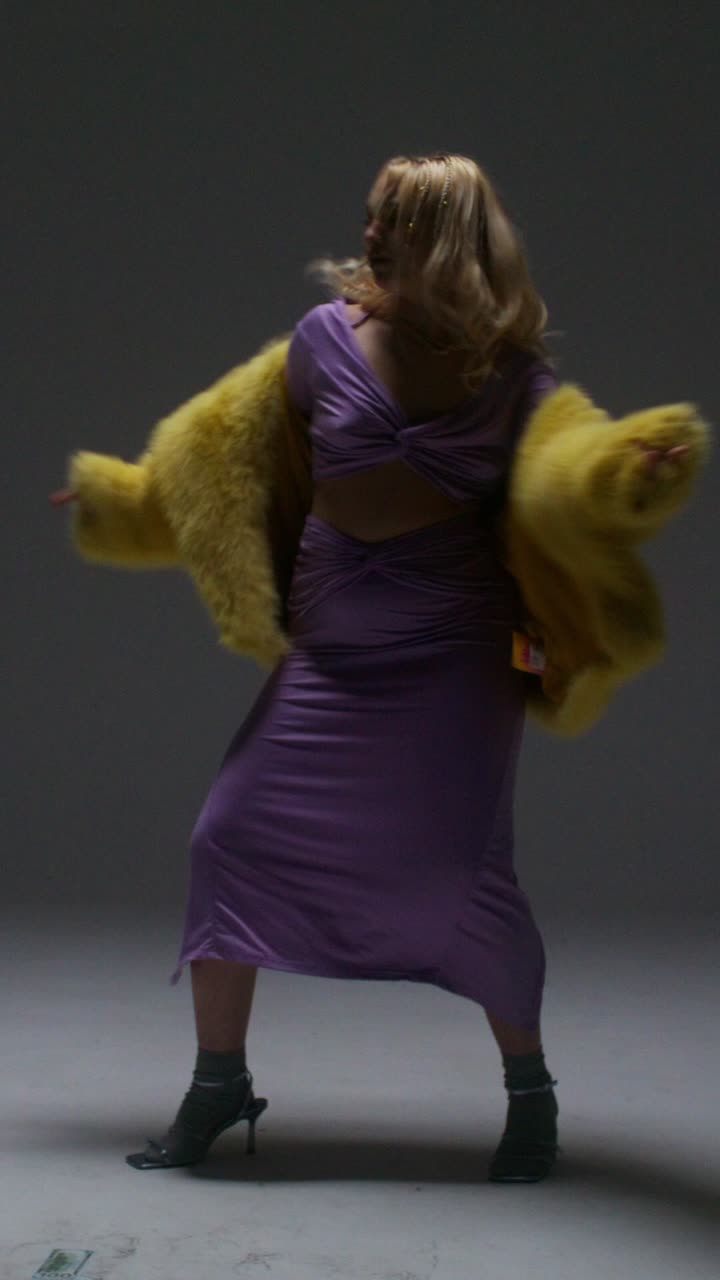 Fashion Model Posing in Yellow Fur Jacket and Purple Skirt