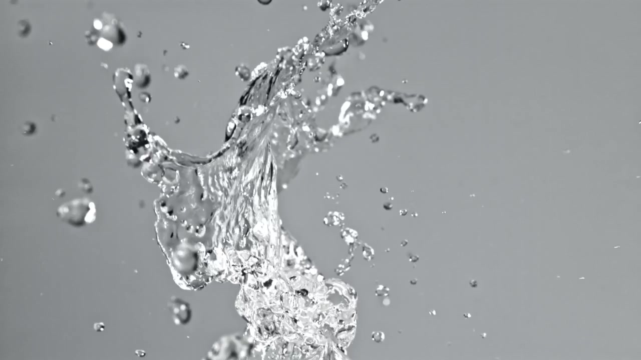 Dynamic Water Splash and Droplets Against a Grey Background
