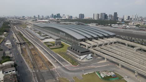 aerial pullback from thailand's new railway hub, bang sue grand station in bangkok