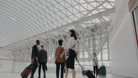 business professionals in a modern airport terminal