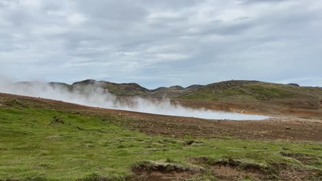 steam rising from engjahver, seen from the ground on the reykjanes peninsula in iceland