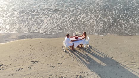 a couple enjoying a romantic dinner with wine couple enjoying a wine evening together