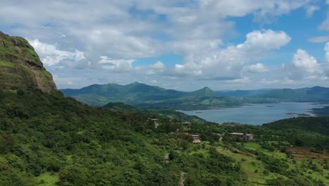 Road-trip-on-Indian-road-in-Monsoon---Rainy-season-seen-here-at-Dudhiware-Khind-at-Lonavala,-India---most-selling-stock-aerial-drone-footage