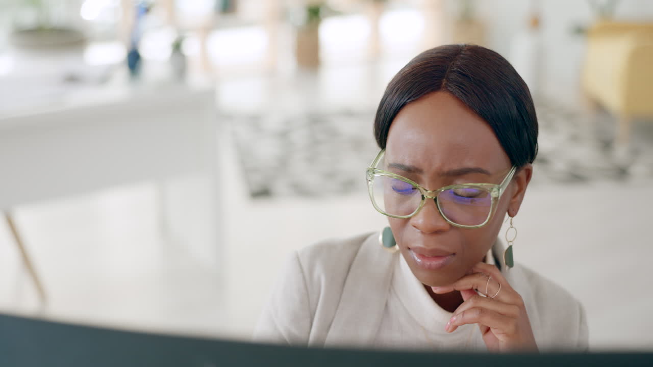 Doubt, confused and business woman on computer