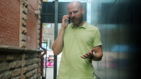 man on phone in alley