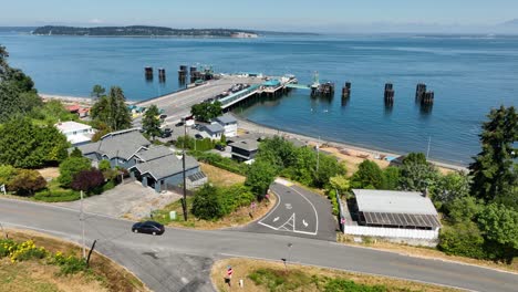 aerial shot of car leaving the clinton ferry loading dock on whidbey island