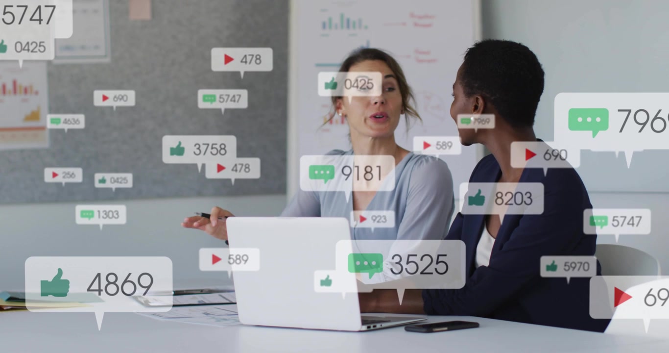 Metrics overlay appearing, colleagues leaning and gesturing while typing, analyzing engagement data