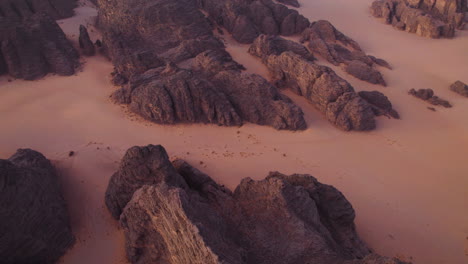 sandstone rocks on desert landscape of tassili n'ajjer national park at sunrise in algeria