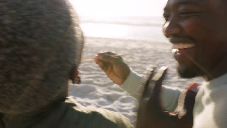 Happy-black-couple,-sushi-and-beach-picnic-eating