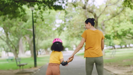 Mother-and-daughter-rollerblading-in-a-park