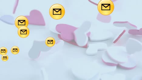 multiple message icons floating over multiple hearts falling against white background