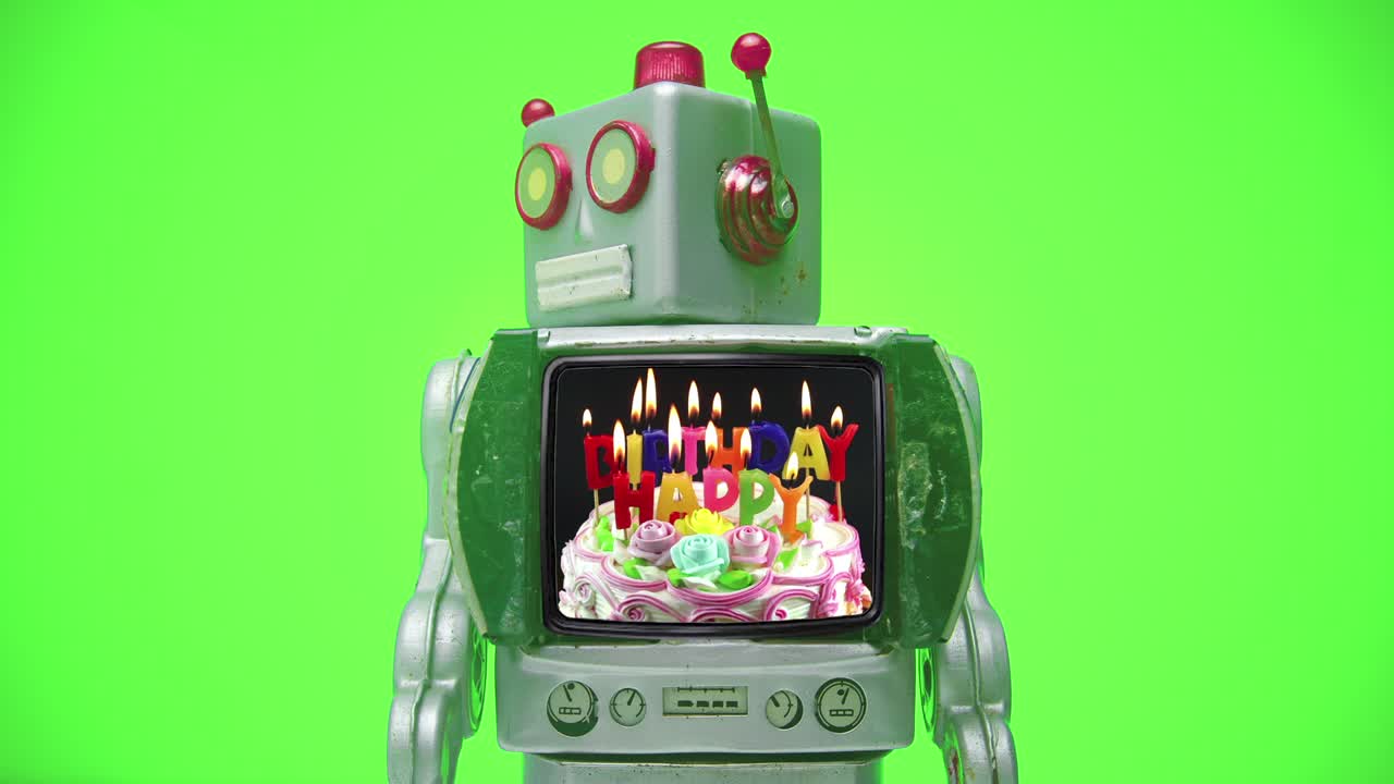 Un robot TV retrò avanza con un messaggio di BUON COMPLEANNO.