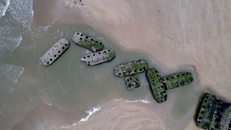 aerial view of mulberry harbor ruins from world war 2 in arromanche normandy france