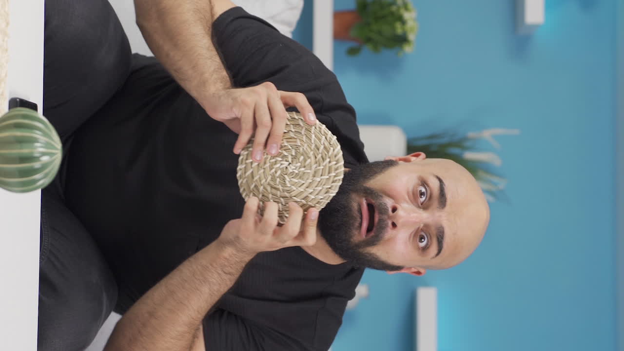 Vertical video of Fun guy making fun of camera.