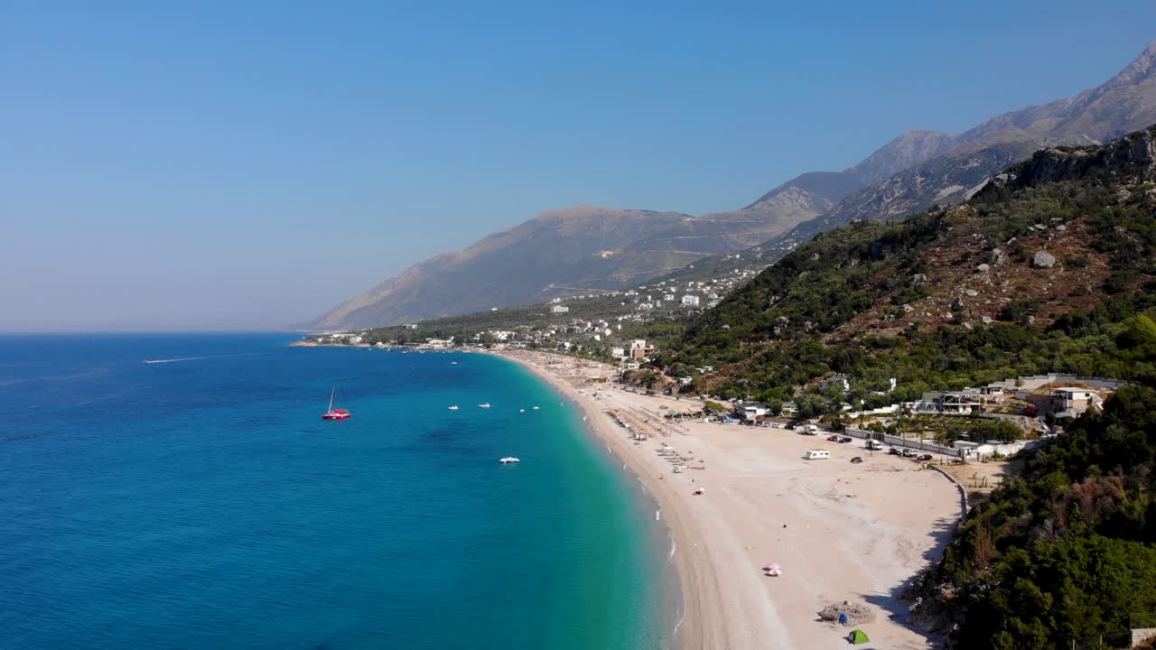 Resorts and touristic villages on beautiful coastline with beaches washed by blue azure sea water in Albania