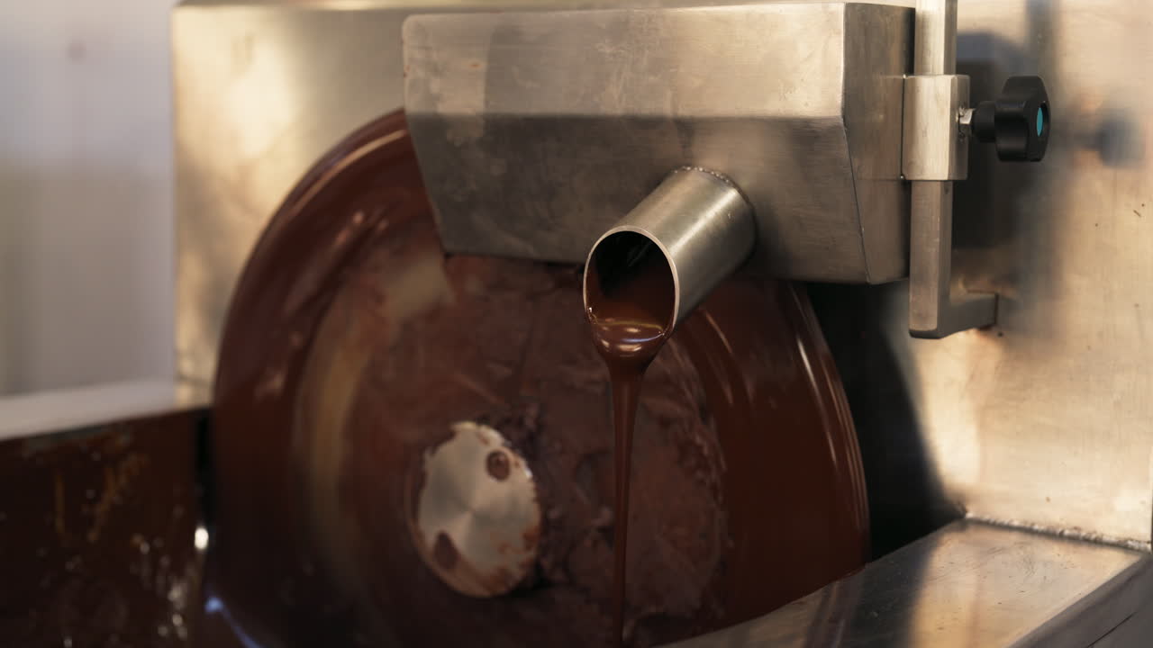 Medium shot of a chocolate-making machine, interior