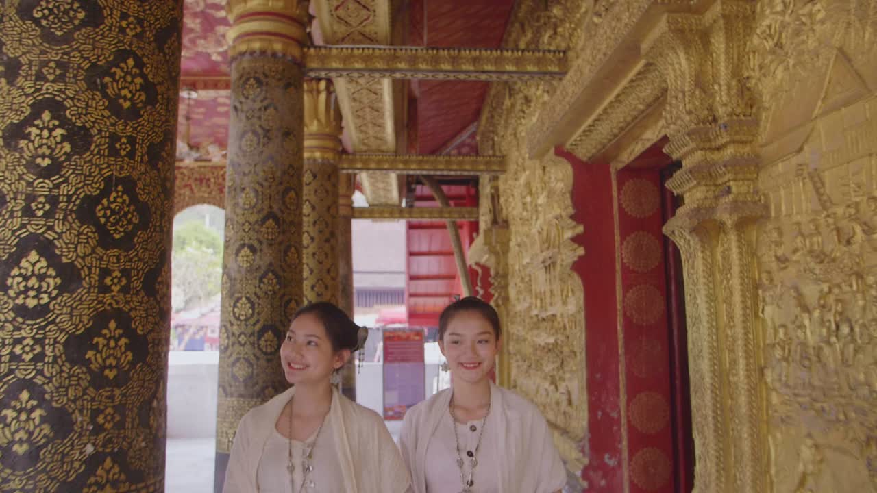 Asian Girls In Lao Traditional Costume Walking In Temple, Slow Motion