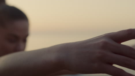 Sportswoman-making-warrior-3-pose-at-twilight-closeup.-Woman-standing-yoga-asana