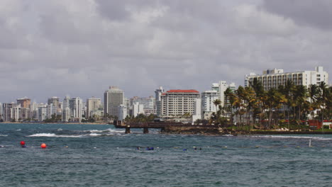 holiday apartment buildings of condando beach, view across el boqueron bay, san juan, puerto rico