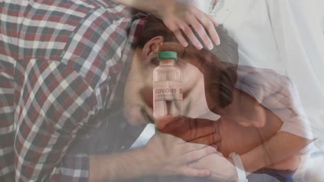 animation of male doctor holding covid 19 vaccine over pregnant couple