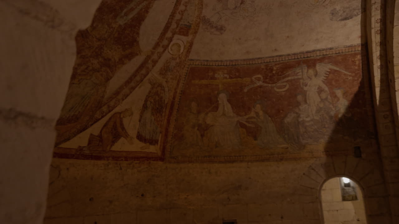 Medieval frescoes in the crypt of Saint-Aignan, France, showcasing religious art