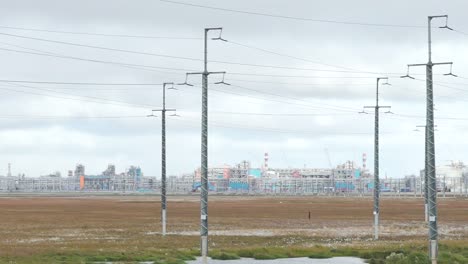 Oil Refinery and Power Lines in a Flat Landscape