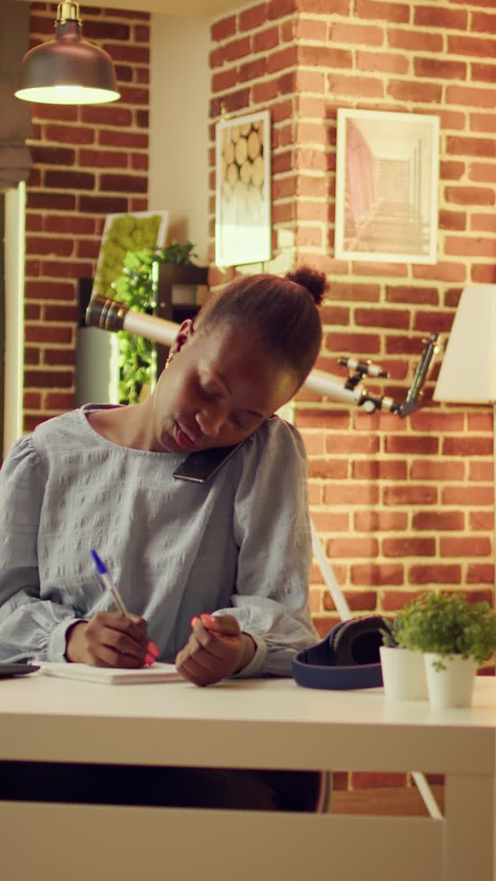 Vertical Woman takes handwritten notes