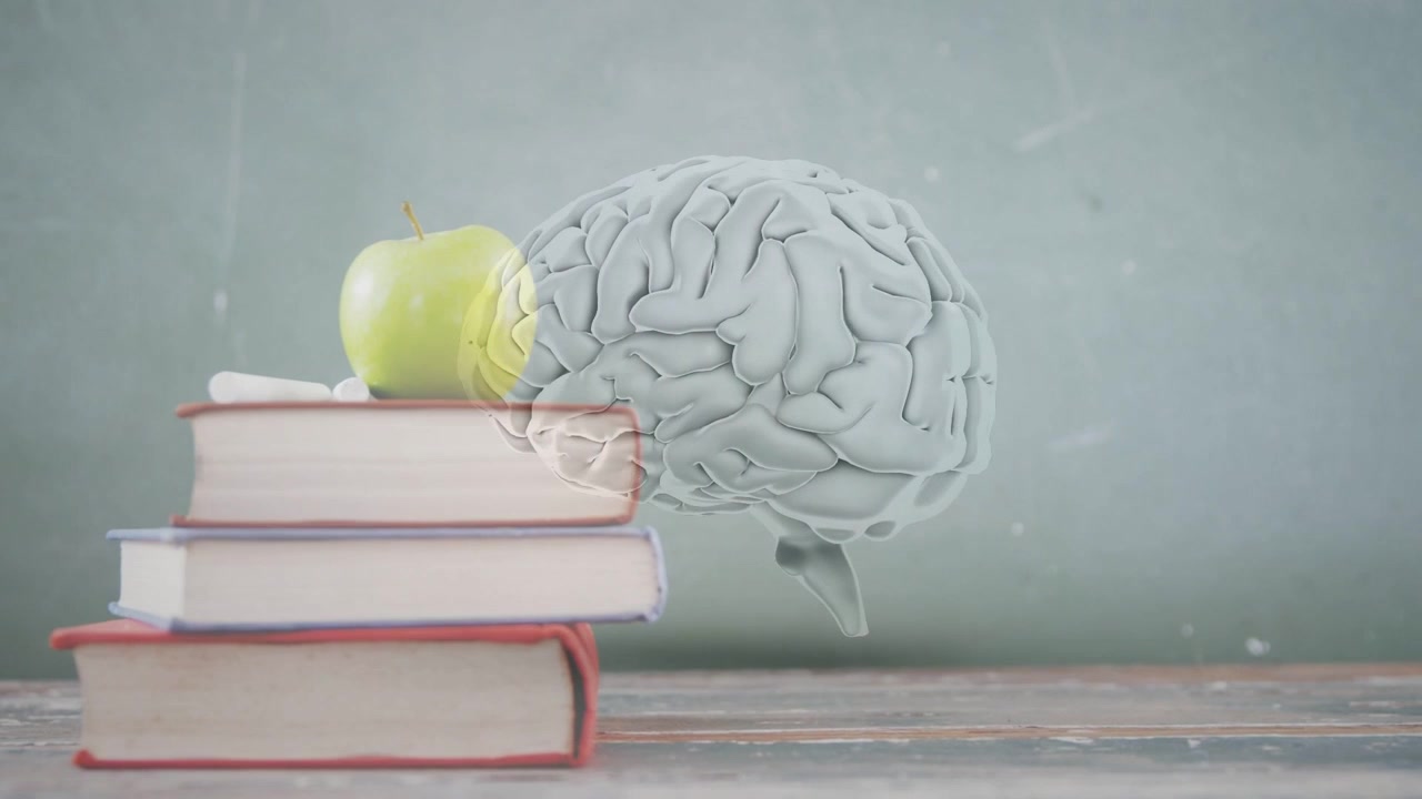 Cervello 3D che fluttua sopra la scrivania mentre libri con cime a forma di mela entrano da sinistra, causando un bagliore giallo che mostra la memoria.