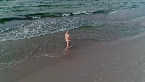 beautiful woman in yellow bikini on tropical beach