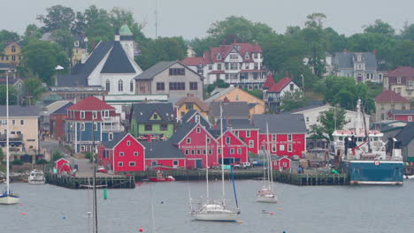 small colourful community with homes and stores in nova scotia, canada on an overcast day