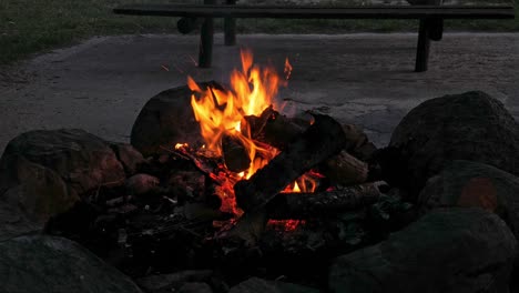 A-medium-shot-of-a-bonfire-started-at-a-campsite