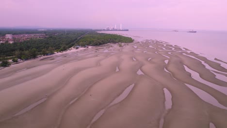 Aerial-flying-backwards-over-Bagan-Lalang-coastal-beach,-Sepang,-Malaysia