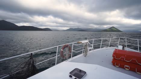 slowmo - panorama view from front deck of cruise boat on cloudy day in new zealand