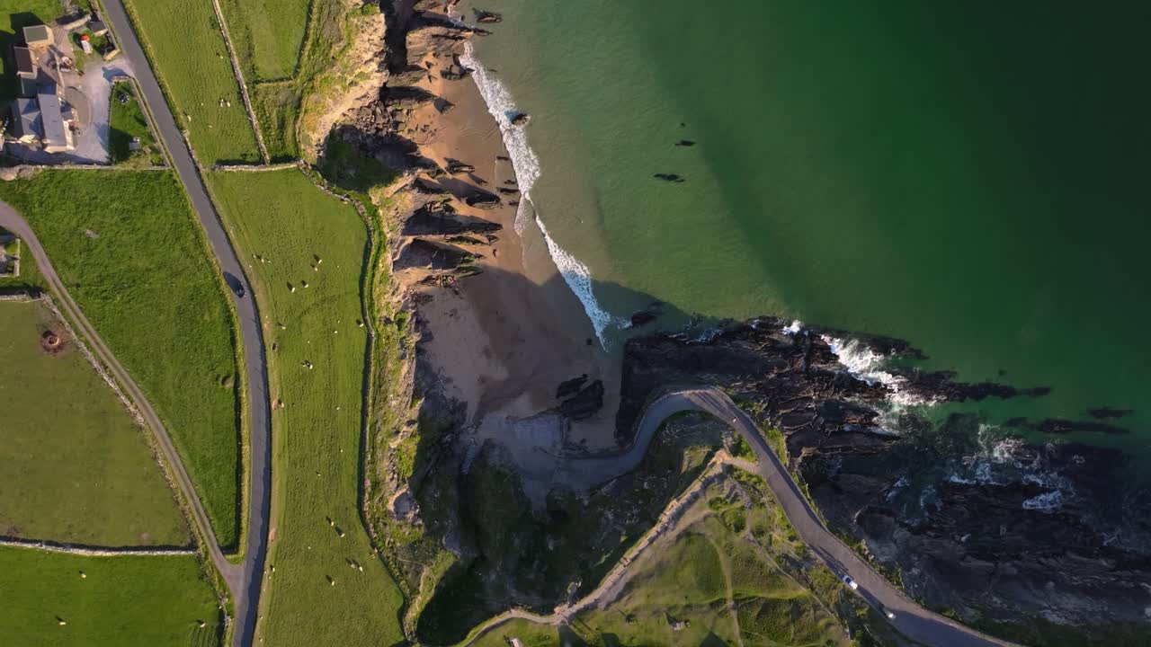 Coumeenoole Beach glowing under bright sunshine, with clear skies and turquoise waves - Dingle Co.Kerry - 4K Cinematic Drone Footage 06
