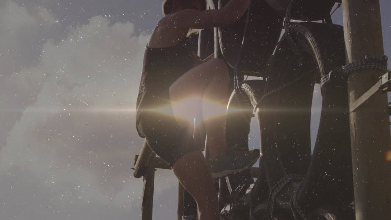 Climbing ladder, person silhouetted by sunlight, creating dramatic animation effect