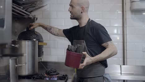 chef preparing charcoal for cooking
