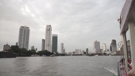 Passing trough the river, over the building, by boat