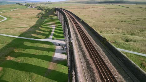 Viaduct-railway-bridge-spanning-English-moorland-with-single-line