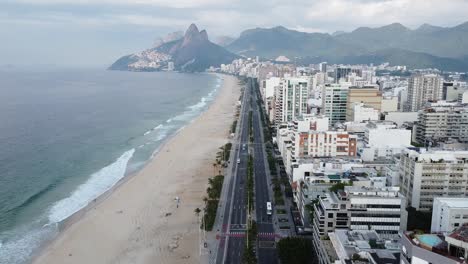 Side-by-Side,-the-sea,-the-beach,-the-city-and-the-mountais