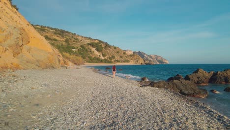 drone moving forward and sideways at a rocky beach