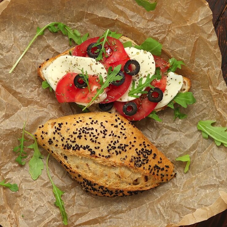 Delicious fresh Bruschetta with tomato basil black olives and mozarella cheese